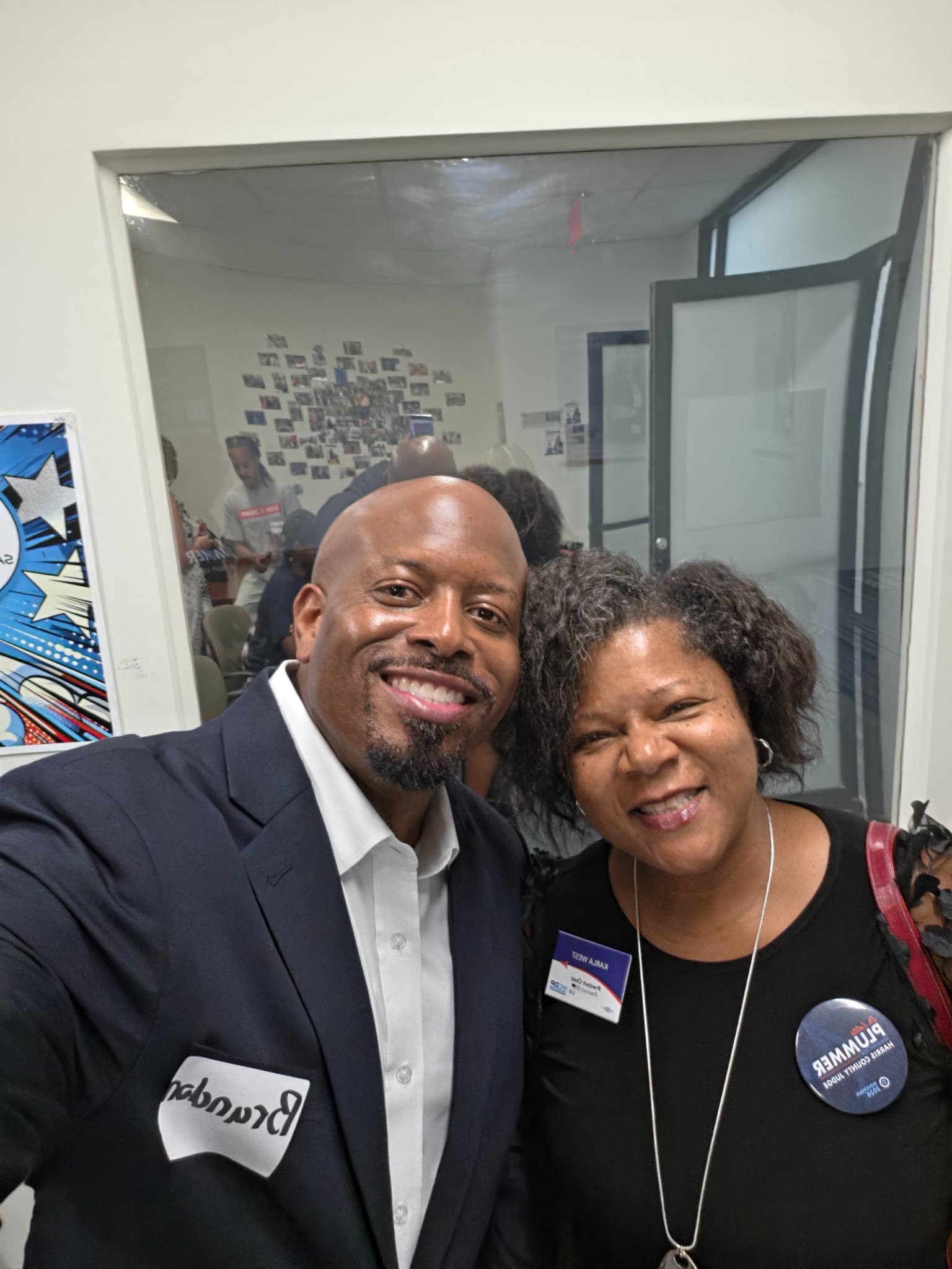 Brandon K. Taylor with a community leader at a public event